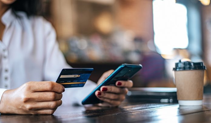 Pay for goods by credit card through a smartphone in a coffee sh